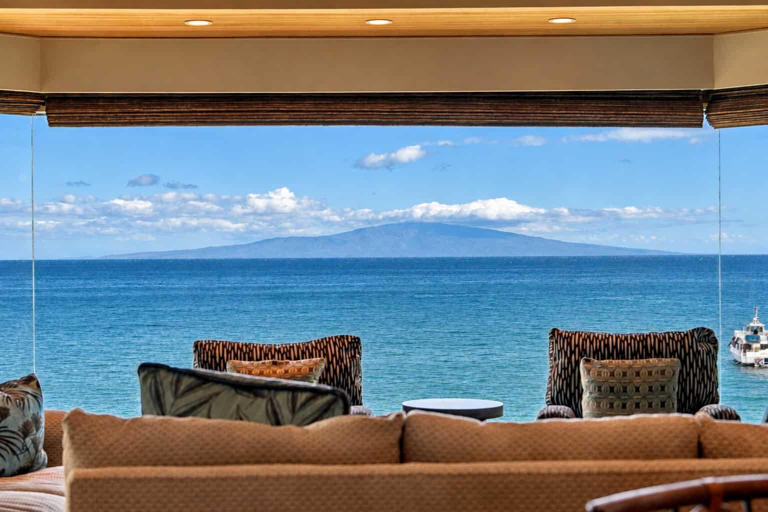 Living room of Residence 1104 opening to a front row ocean view